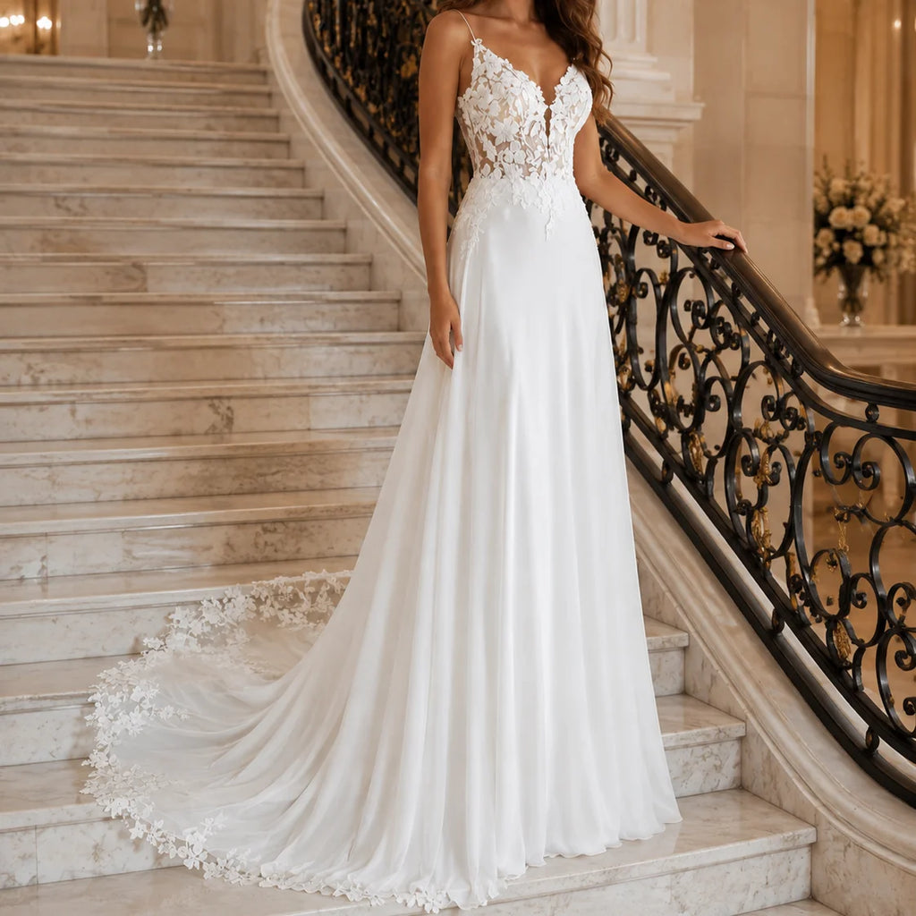 Romantic white wedding dress with spaghetti straps and lace bodice